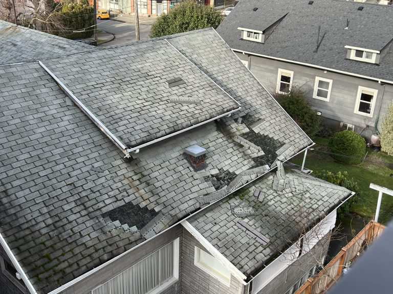 a roof with extensive damage and missing tiles