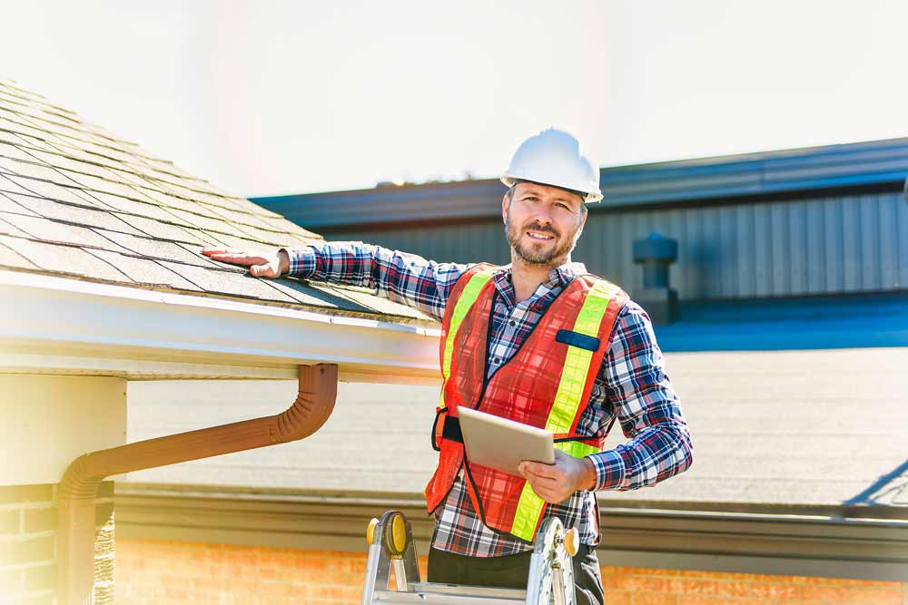 A home inspector checking a roof 